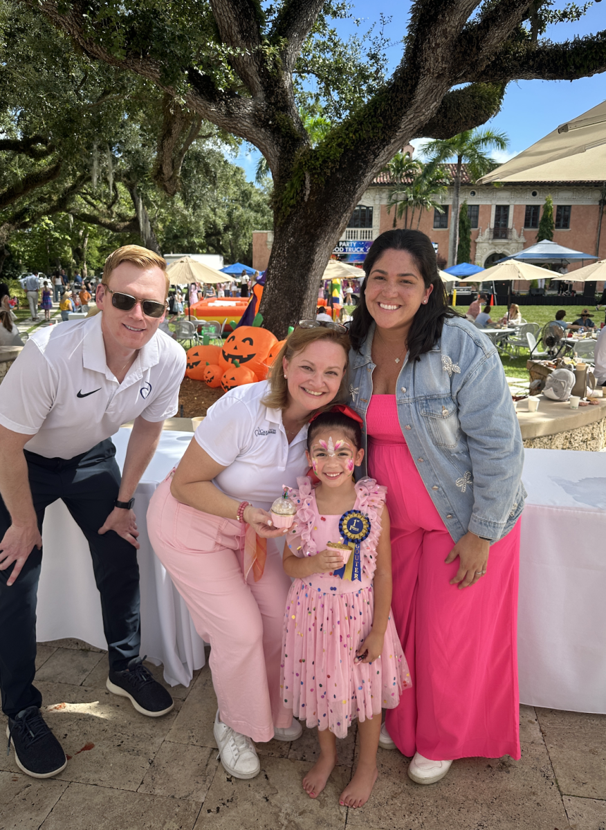 Mr. Coyle and Mrs. Gillinghan-Rivas pose with attendees.