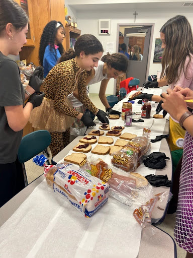 Every Thursday, students prepare sandwiches to donate to the Grove Community Fridge. 