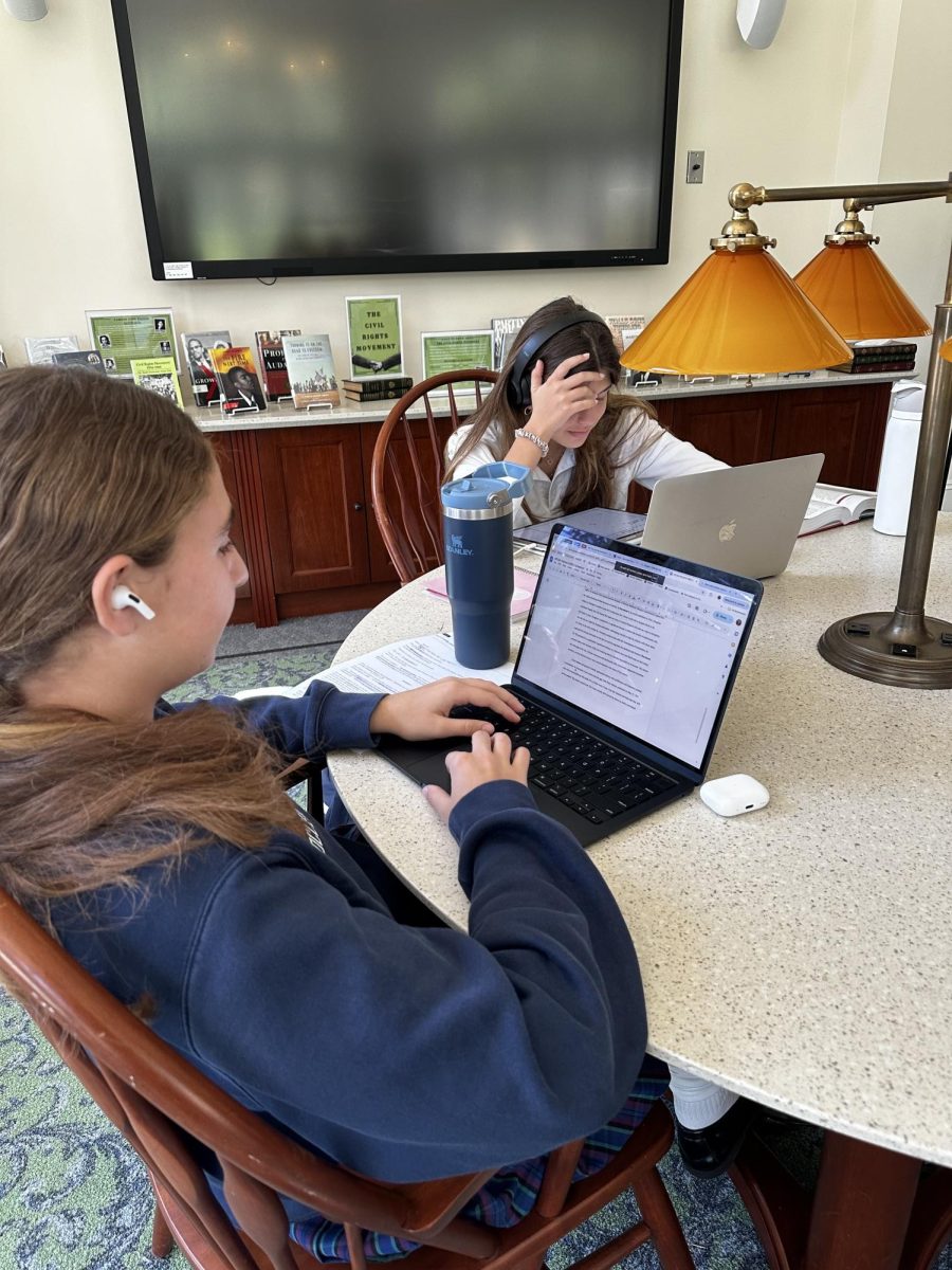 Carolina Torres and Natalie Deschapelles use music to help them study. 