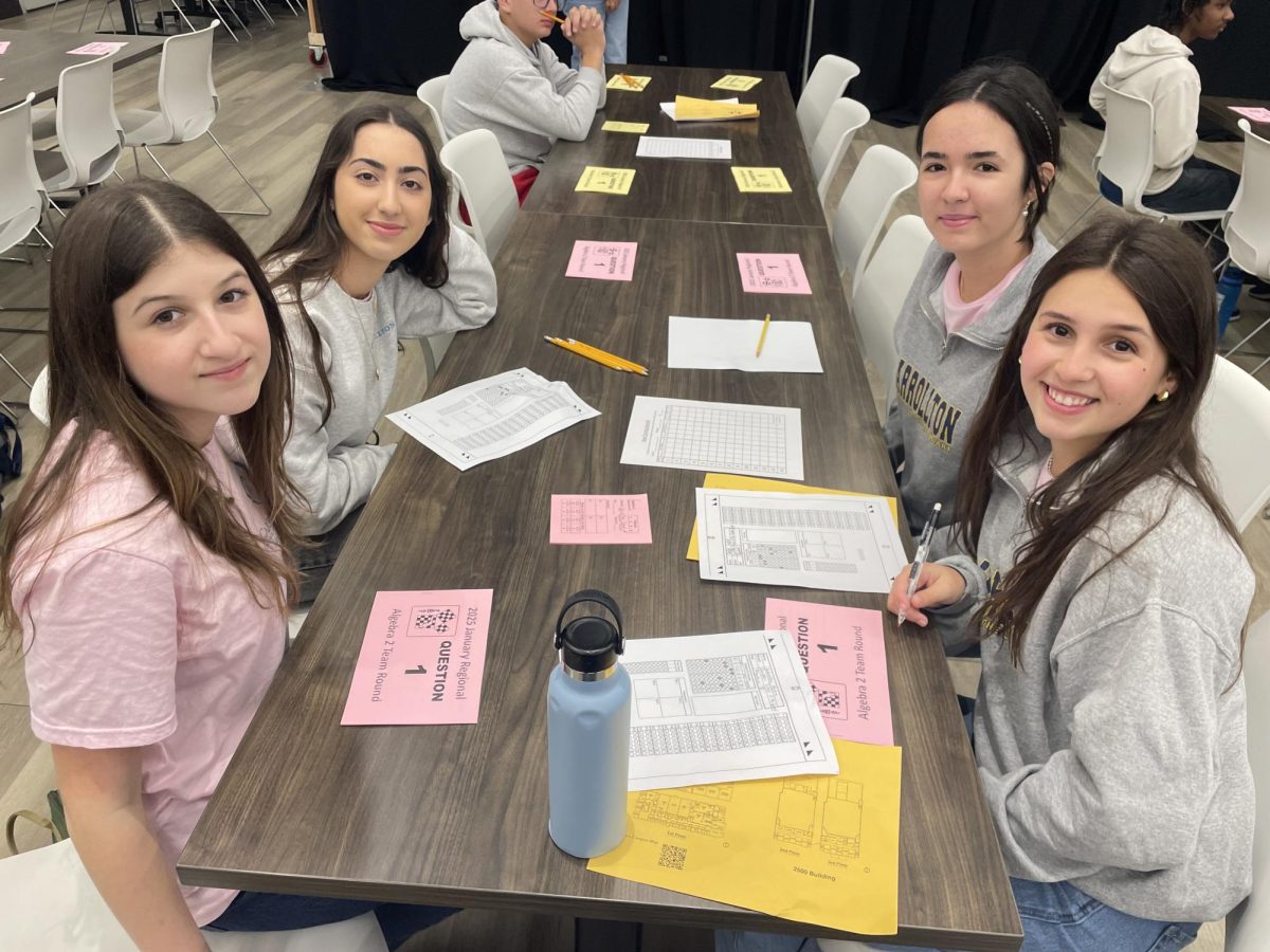 Gabriella Perez '27, Lila Malmierca '27, Alexandra Coto '27, and Sofia Sotelo '28 at the team competition table for Algebra II.