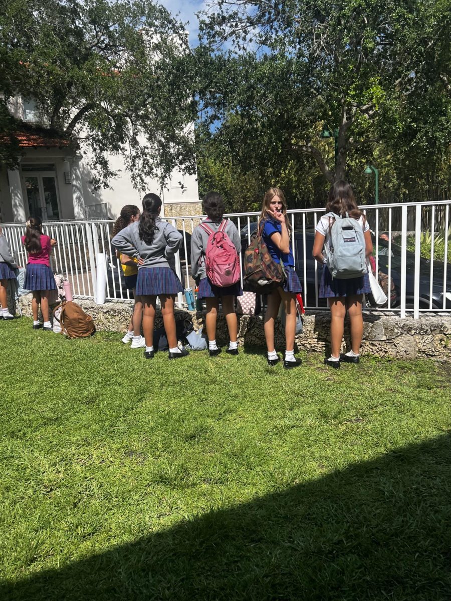 Students gather outside on the Duchesne Campus to wait for their rides. 