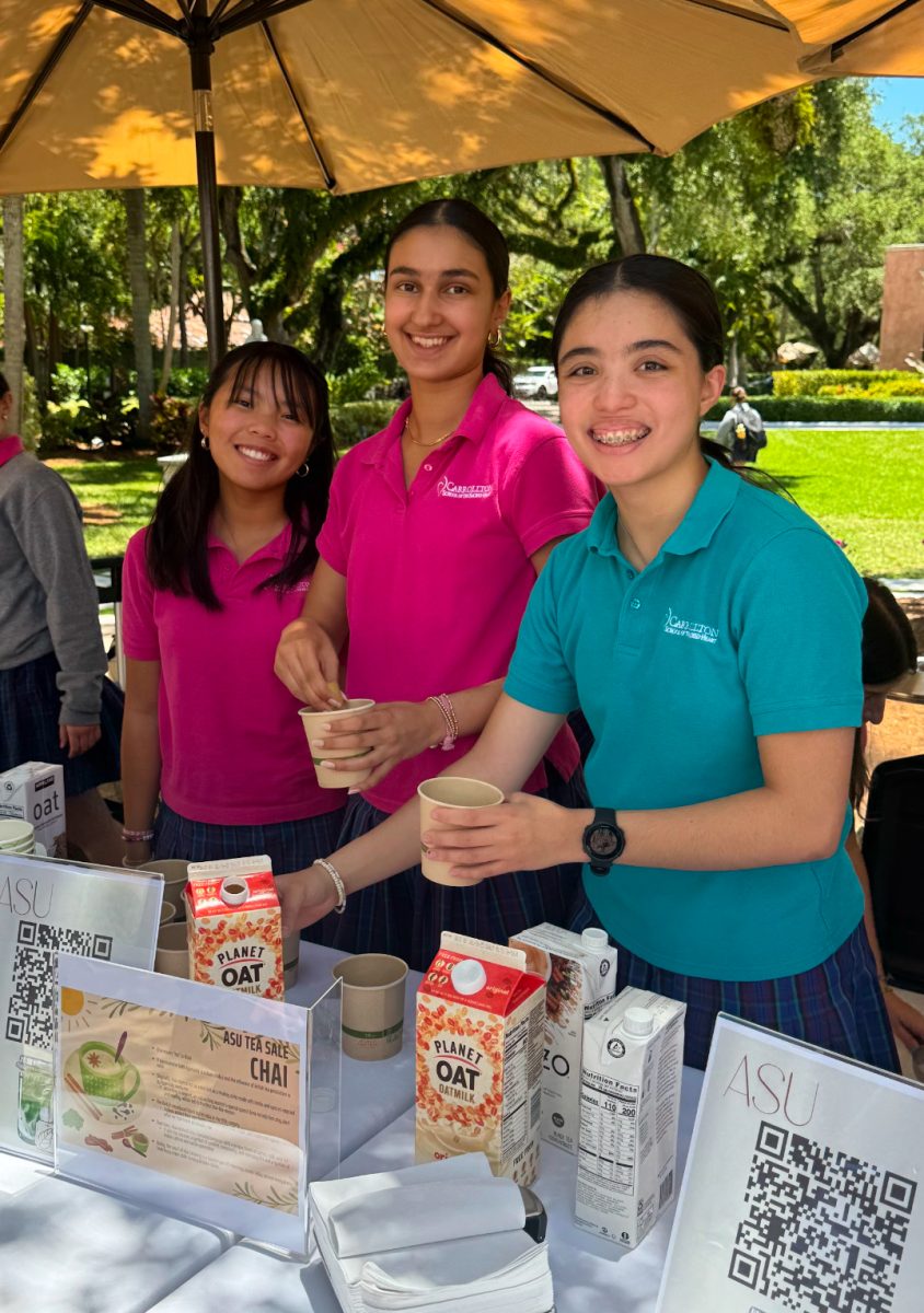 Leighton Rivero '27, Audrey Prabhakar '27, and ASU President Nina Heffron '27 serve tea to fundraise. 