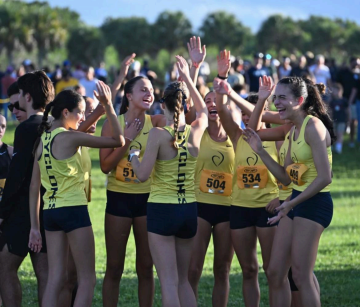 The varsity cross country team races at the Spanish River XC invite on Sept. 19.