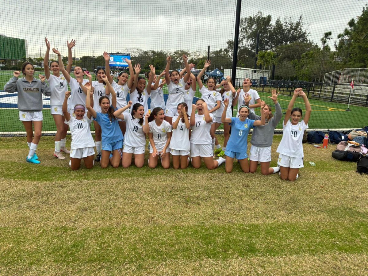Middle school soccer A team celebrates win against Ransom Everglades. 
