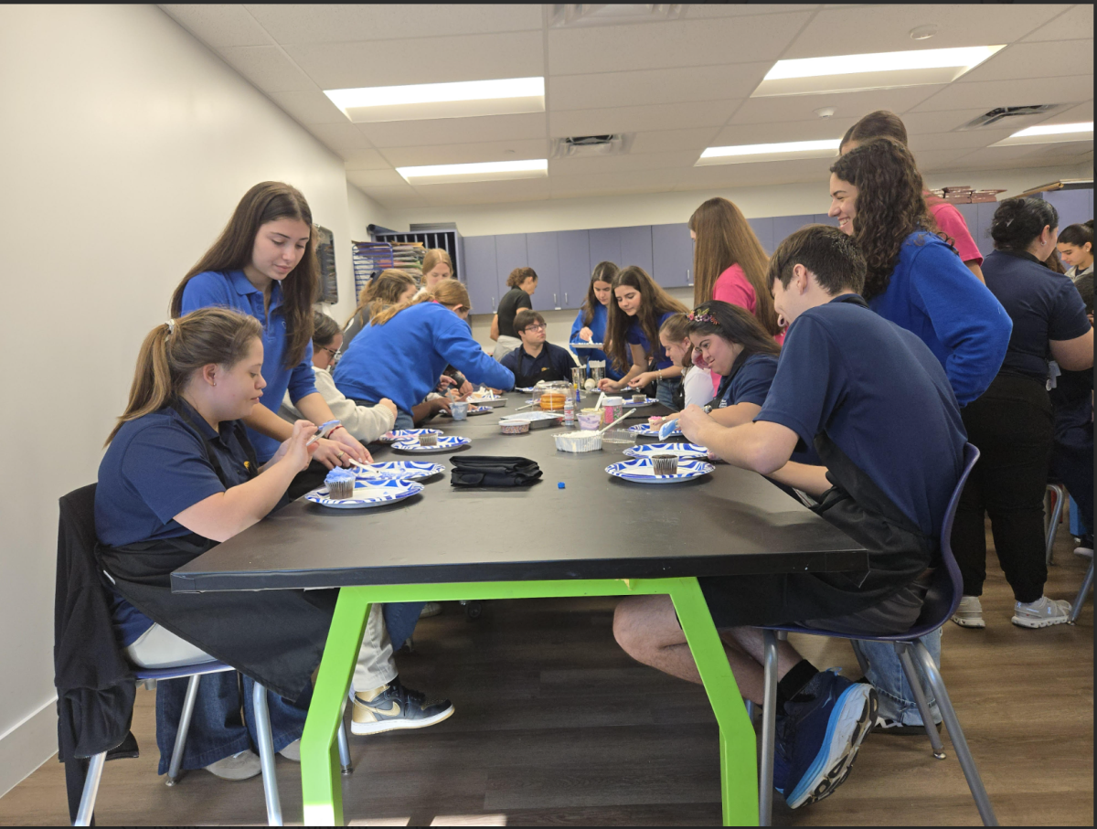 Carrollton students do an activity with students at MLE.