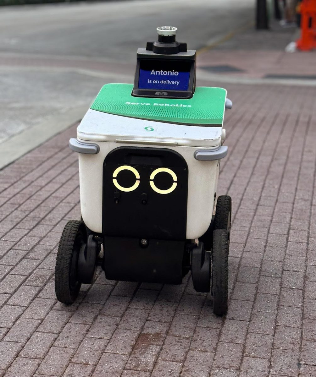 A self-driving robot named Antonio makes a delivery in The Grove.